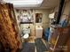 Basement bathroom with a toilet, shower, vanity, and hot water heater at 6229 Mountain Grove Rd, Hickory, NC 28602