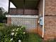 Close up of brick foundation with decorative blocks and lush landscaping around this charming property at 6229 Mountain Grove Rd, Hickory, NC 28602
