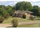 Charming brick home with a well-maintained lawn and mature landscaping creates a welcoming curb appeal at 6229 Mountain Grove Rd, Hickory, NC 28602