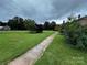 Well-maintained front yard featuring a sidewalk and lush green lawn leading up to the house at 6229 Mountain Grove Rd, Hickory, NC 28602