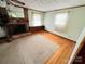 Living room with fireplace, carpet, wood floors, natural light and a brick fireplace at 6229 Mountain Grove Rd, Hickory, NC 28602