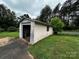 Exterior view of the detached garage with concrete walls and an open garage door at 6229 Mountain Grove Rd, Hickory, NC 28602