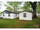 View of back of house and outbuilding at 706 Mcintyre St, Monroe, NC 28110
