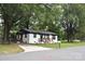 Charming exterior featuring a freshly painted home, new windows, and a driveway at 706 Mcintyre St, Monroe, NC 28110