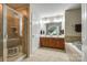 Spacious bathroom featuring a walk-in shower, double sink vanity, and a soaking tub at 714 Deerbrook Ln, Tega Cay, SC 29708