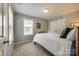 Simple bedroom with a cozy bed, neutral walls, and closet space for storage at 714 Deerbrook Ln, Tega Cay, SC 29708