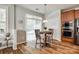 Cozy breakfast nook with natural light, complemented by wood floors and a built-in microwave at 714 Deerbrook Ln, Tega Cay, SC 29708