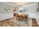 Formal dining room showcasing stylish decor, modern chandelier, and refined architectural details at 714 Deerbrook Ln, Tega Cay, SC 29708