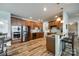 Well-appointed kitchen with stainless steel appliances, wood cabinets, and convenient breakfast bar seating at 714 Deerbrook Ln, Tega Cay, SC 29708