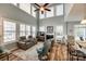 Vaulted living room filled with natural light, fireplace, and comfortable seating, perfect for relaxation at 714 Deerbrook Ln, Tega Cay, SC 29708