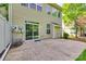 Backyard patio with a sliding glass door that leads to the house and a well-manicured lawn at 714 Deerbrook Ln, Tega Cay, SC 29708