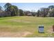Putting green for practicing your golf skills with the 'Sugar Cay Golf Club' putting only sign at 714 Deerbrook Ln, Tega Cay, SC 29708