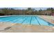 Community swimming pool with clear blue water and marked lanes for exercising and recreation at 714 Deerbrook Ln, Tega Cay, SC 29708