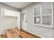 View of a room with hardwood floors, window with white shutters and a large closet at 729 Tenth Ne Ave, Hickory, NC 28601