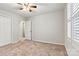 Neutral bedroom featuring carpet, ceiling fan, and an adjoining doorway at 729 Tenth Ne Ave, Hickory, NC 28601