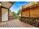 Back deck with a covered ceiling, wooden fence, and decorative plants at 729 Tenth Ne Ave, Hickory, NC 28601
