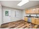 View of the kitchen with wood cabinets, stainless steel appliances, and hardwood floors at 729 Tenth Ne Ave, Hickory, NC 28601