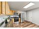 The kitchen has stainless steel appliances, wood cabinets, and a granite countertop at 729 Tenth Ne Ave, Hickory, NC 28601