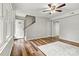 Living room with staircase, hardwood floors, front door, and ceiling fan at 729 Tenth Ne Ave, Hickory, NC 28601