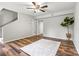 Living room with staircase, hardwood floors, doorway, and ceiling fan at 729 Tenth Ne Ave, Hickory, NC 28601