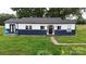 Charming one-story home features a blue and white exterior, black front door and well-maintained lawn at 751 Northbrook Iii School Rd, Vale, NC 28168