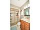 Updated bathroom featuring a shower with a glass door and vanity at 7518 Surry Ln, Indian Trail, NC 28079