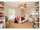 Inviting bedroom with a ceiling fan, modern decor, and ample storage at 7518 Surry Ln, Indian Trail, NC 28079