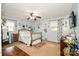 Light-filled bedroom with a ceiling fan and modern decor at 7518 Surry Ln, Indian Trail, NC 28079