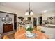 Eat-in dining area with updated lighting, granite countertops, and stainless appliances at 7518 Surry Ln, Indian Trail, NC 28079