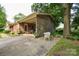 Brick ranch home with covered carport, and outdoor seating, perfect for enjoying the outdoors at 7518 Surry Ln, Indian Trail, NC 28079