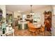 Charming eat-in kitchen with wood floors, stainless appliances and bar seating at 7518 Surry Ln, Indian Trail, NC 28079