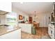 Bright eat-in kitchen featuring modern appliances, granite countertops, and eat-in area at 7518 Surry Ln, Indian Trail, NC 28079