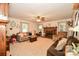 Cozy living room features a brick fireplace and comfortable seating at 7518 Surry Ln, Indian Trail, NC 28079