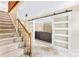 Inviting foyer with carpeted stairs, tile flooring, and sliding barn doors to an adjacent room at 7528 Red Oak Ln, Charlotte, NC 28226