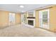 Cozy living room with a white painted brick fireplace, natural light, and neutral colors at 7528 Red Oak Ln, Charlotte, NC 28226