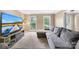 Comfortable living room featuring a large gray sectional couch, neutral tones, and bright natural light at 7528 Red Oak Ln, Charlotte, NC 28226