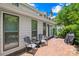 Charming patio with brick flooring, seating, and outdoor grill, perfect for entertaining at 7528 Red Oak Ln, Charlotte, NC 28226