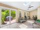 Inviting sunroom with skylights, exercise equipment, and access to an outdoor patio at 7528 Red Oak Ln, Charlotte, NC 28226