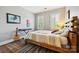 Comfortable bedroom with hardwood floors, natural light, and eclectic decor at 8109 Hawk Crest Ct, Charlotte, NC 28270