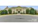 Exterior shot of a well maintained and landscaped community clubhouse with a welcoming entrance at 8109 Hawk Crest Ct, Charlotte, NC 28270