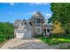 Charming two-story home with a stone facade, manicured lawn, and inviting front porch at 8109 Hawk Crest Ct, Charlotte, NC 28270