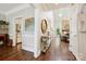 Elegant foyer with hardwood floors, skylight, and views of the living room and kitchen at 8109 Hawk Crest Ct, Charlotte, NC 28270