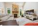 Inviting living room featuring a stone fireplace, and ample natural light at 8109 Hawk Crest Ct, Charlotte, NC 28270