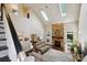 Open living room with vaulted ceilings, stone fireplace, and skylights, showcasing spacious design at 8109 Hawk Crest Ct, Charlotte, NC 28270