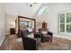Spacious main bedroom with vaulted ceiling, hardwood floors, a four-poster bed and ample natural light at 8109 Hawk Crest Ct, Charlotte, NC 28270