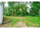 Expansive backyard featuring a lush lawn and mature trees, offering a serene and private outdoor space at 812 Kings Rd, Shelby, NC 28150