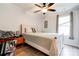 Comfortable bedroom with neutral walls, ceiling fan, and bright window at 812 Kings Rd, Shelby, NC 28150
