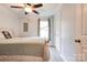 Light-filled bedroom with ceiling fan, double closet, and light wood-look flooring at 812 Kings Rd, Shelby, NC 28150
