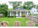 Charming single-story home featuring a covered front porch and a well-maintained front yard with a picket fence at 812 Kings Rd, Shelby, NC 28150