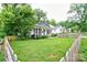 Inviting home with a covered porch, mature trees, and a lush green lawn at 812 Kings Rd, Shelby, NC 28150